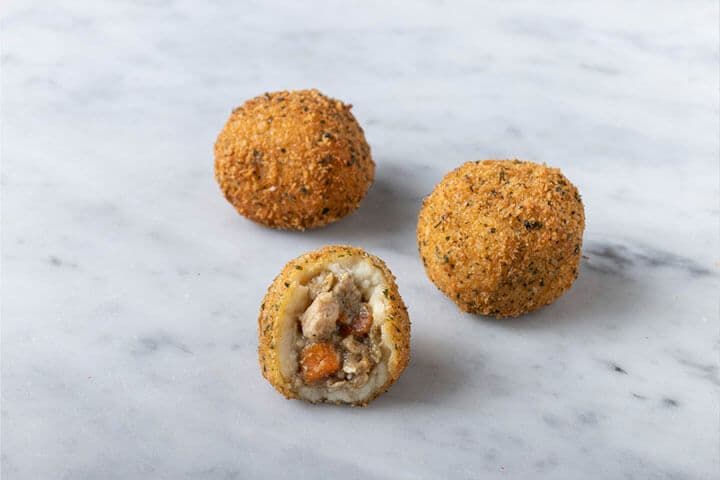 Porto's Turkey & Gravy Potato Balls, one cut open
